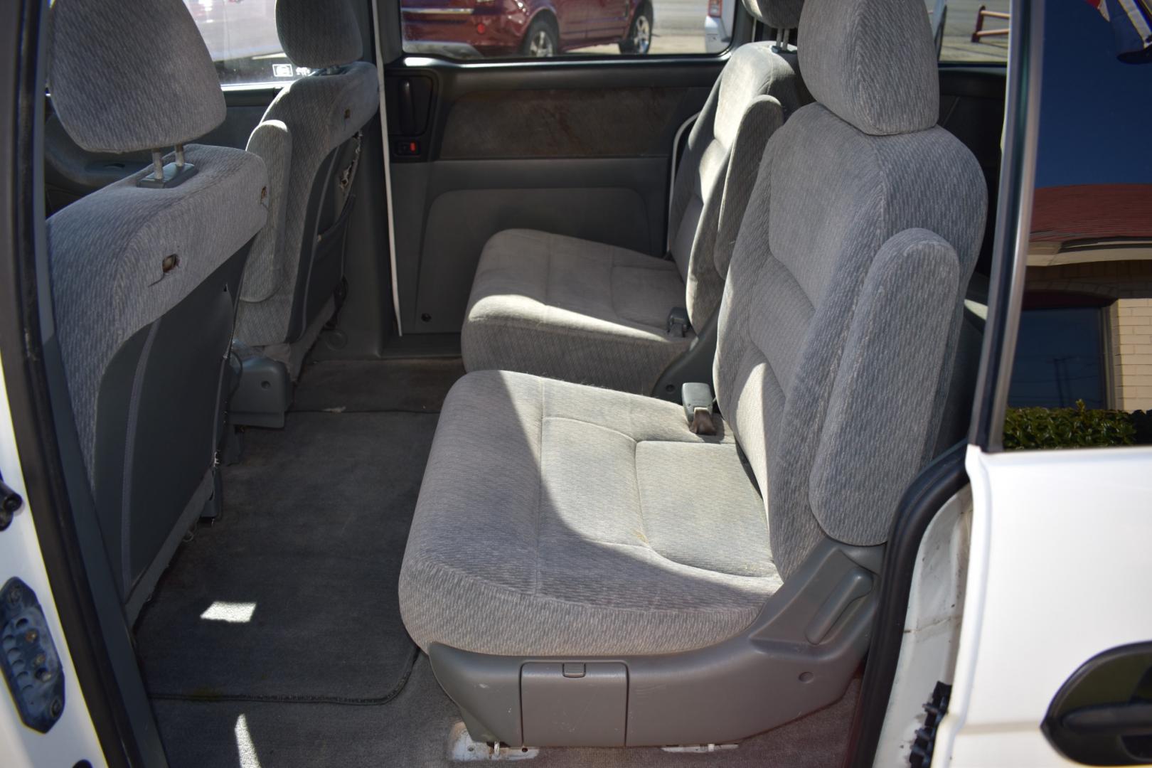 2003 White /Gray Honda Odyssey (5FNRL18513B) , located at 5925 E. BELKNAP ST., HALTOM CITY, TX, 76117, (817) 834-4222, 32.803799, -97.259003 - Buying a 2003 Honda Odyssey can be a smart choice for several reasons: Reliability: Hondas are known for their reliability, and the Odyssey is no exception. The 2003 model year is often praised for its durability and long-lasting performance. Safety: The 2003 Honda Odyssey comes equipped with safe - Photo#20